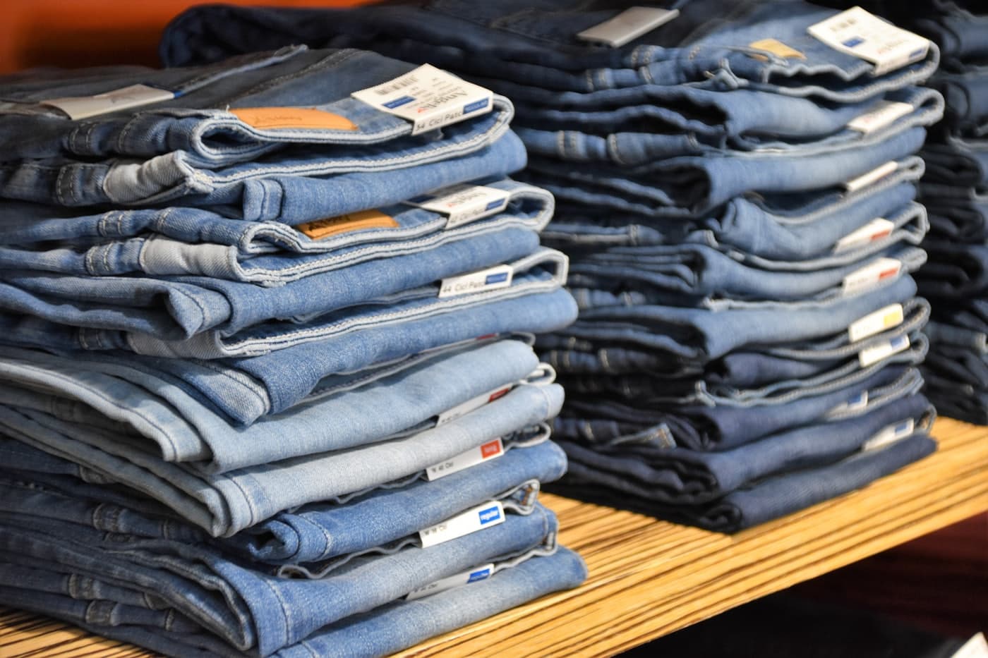 Folded denim arranged by wash