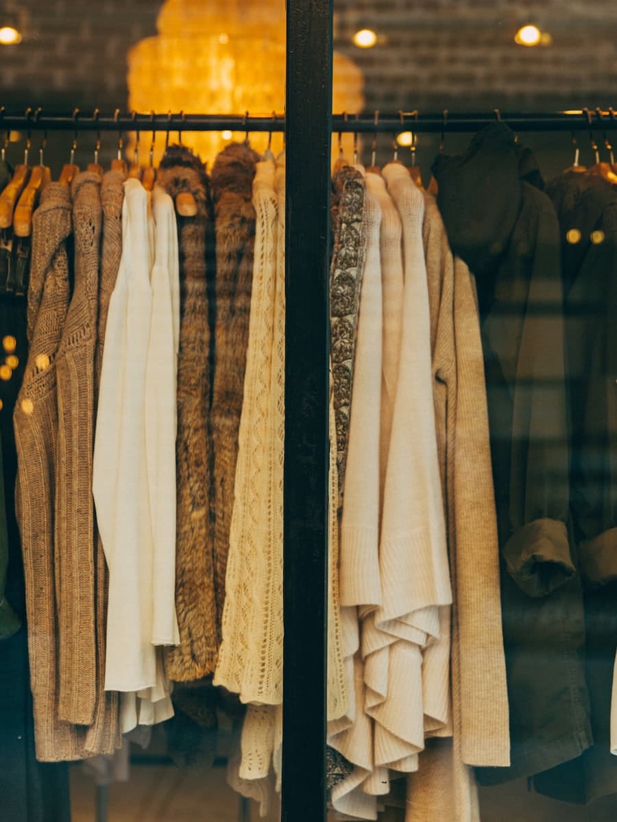 Curated knitwear in a warm boutique window